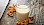 Mandeln und ein Glas mit Mandelmilch auf Holzunterlage - © stock.adobe.com / viperagp / #107324655